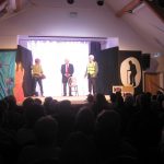 Actors performing on the stage at the Ashurst Village Hall